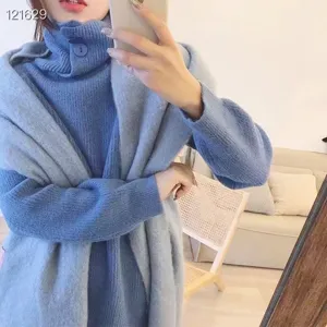 Macaron blue mohair turtleneck sweater and matching thick winter warm knit scarf detail.
