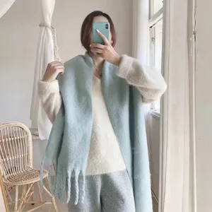 Cozy macaron blue mohair oversized winter scarf for women, soft warm solid color design.