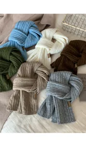 Cozy solid color ribbed knit winter scarf for women, soft warm daily wear accessory.