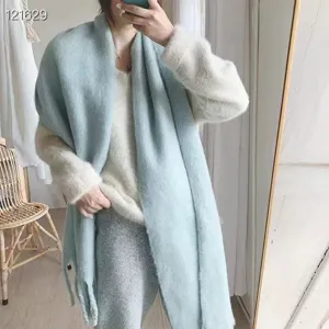 Macaron light blue mohair thick winter scarf detail featuring a soft fluffy texture.