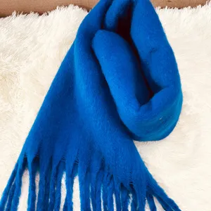 Blue mohair winter scarf detail view, cozy thickened tassel design for cold weather warmth.