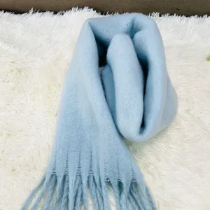 Cozy solid color winter scarf for women, soft fluffy plush material with elegant fringe design.