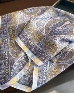 Exquisite vintage ethnic print silk scarf detail, elegant paisley design texture close up