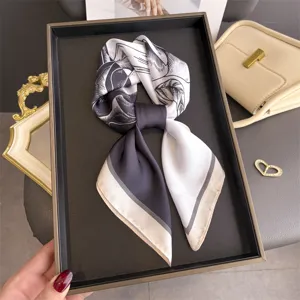 Chic black and white printed silk square scarf, elegant neck accessory for stylish women.