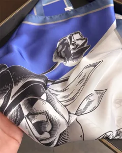 Blue and white color block silk square scarf with elegant sketched floral print for women