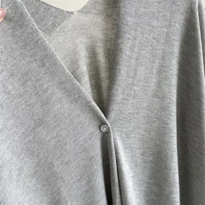 Grey knit summer sunscreen shawl cardigan detail, lightweight button-up cape cover-up for dress.