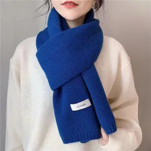 Detailed view of the cozy winter knitted scarf in solid blue, perfect for cold weather.