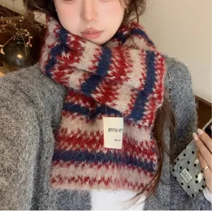 Cozy wool-blend Fair Isle knit scarf with classic red and blue stripes for winter warmth.