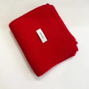 Soft red knitted winter scarf for women and men, cozy solid color warm neck wrap for cold days.