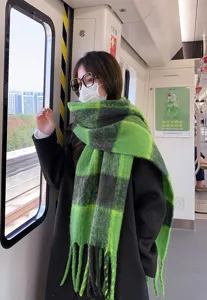 Green and black plaid thick winter warm scarf for women, cozy cozy oversized fashion accessory.