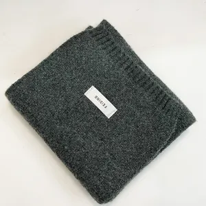 Cozy soft knitted winter scarf in stylish dark green, warm solid color neck wrap for women.