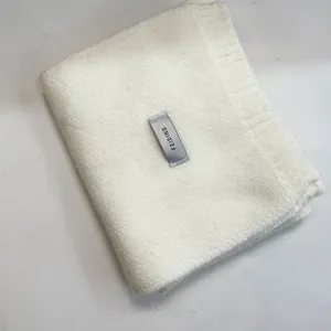 Soft white knitted scarf detail shot, cozy winter wool winter neck warmer apparel accessory.