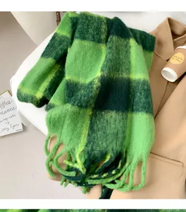 Green plaid winter scarf for women, cozy thick plush material with fringe for cold weather.