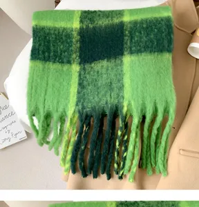 Green plaid fuzzy scarf detailed shot, cozy winter warm thick tartan winter accessory.