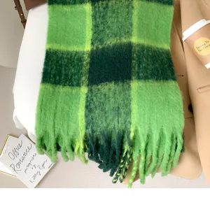 Green plaid mohair texture scarf close-up, soft fluffy winter accessory detail shot.