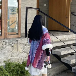 Ethnic style knitted shawl with plush collar and tassel pom poms for women outerwear.