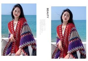 Detailed view of bohemian colorful zigzag knit shawl, ethnic style seaside outdoor wear.