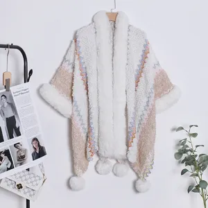 Ethnic knit cloak with plush fur collar and pom poms for women cozy winter fashion shawl