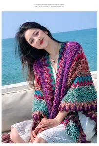 Colorful ethnic knit shawl for women, stylish seaside cape and bohemian outerwear poncho.