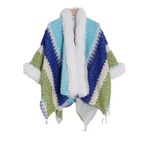 Ethnic style knitted poncho cape with cozy white faux fur collar and colorful warm shawl.