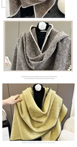Detailed view of the elegant women triangular shawl, soft fabric and stylish edge design.
