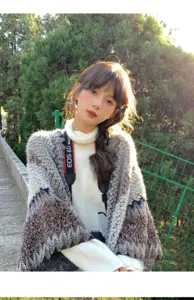 Ethnic knit shawl cape for women, stylish bohemian winter outerwear and travel scarf.