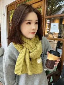 Cozy yellow knitted winter scarf for women and men, warm thick wool neck warmer accessory.