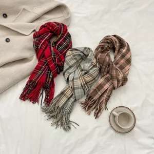 Detailed close-up of cozy autumn winter plaid fringe scarves in multiple colors displayed nicely.