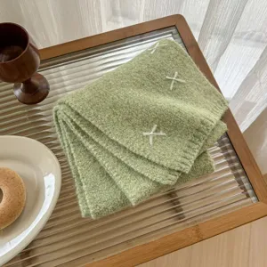 Green wool blend knitted scarf featuring sweet white bow embroidery details, cozy and warm.