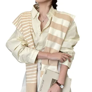 Chic striped knitted shawl for women, stylish cape scarf and shirt outfit for autumn fashion.