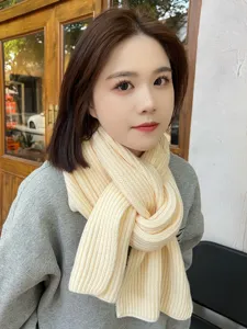 Cozy winter knit scarf for women and men, thick warm wool neck wrap in solid light yellow color.
