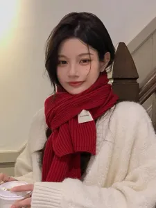 Cozy winter knit scarf detail view, warm woolen neck warmer accessory for cold weather styling.
