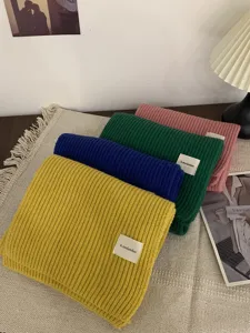 Winter warm thick knitted scarf for women men, cozy woolen neck warmer with stylish ribbed texture.