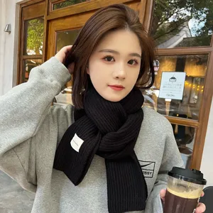 Black winter knitted scarf for women, cozy thick warm ribbed wool muffler for daily cold wear.