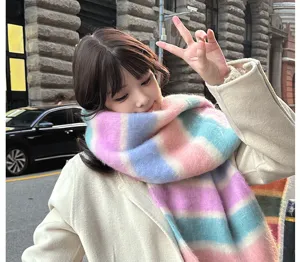 Cozy rainbow mohair winter scarf worn by a model outdoors, thick warm long tassel style.