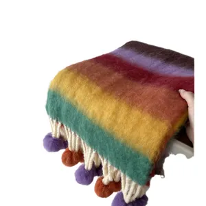 Colorful rainbow mohair winter scarf with cozy fringe and playful pom-poms for women warm.