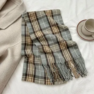 Cozy gray and brown plaid scarf detail, featuring soft imitation cashmere fabric and delicate fringe.