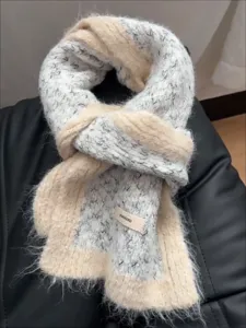 Cozy winter knitted scarf with color block design, soft plush texture for warm daily wear.