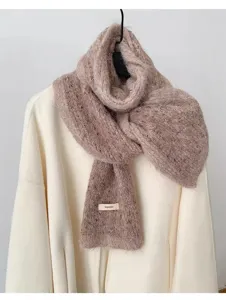 Cozy fuzzy knit winter scarf detail view, soft mocha brown warm scarf texture, chic cold weather.