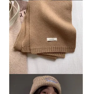 Cozy brown wool knit scarf and beanie set for winter warmth, soft and stylish daily wear.