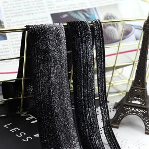 Sparkling black velvet glitter ribbon detail, perfect for DIY hair bows and clothing accessories.