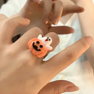 Detailed view of cute Halloween pumpkin ghost resin ring, quirky fashion jewelry item.