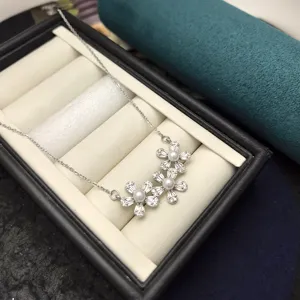 Detailed view of the multi-flower zircon pearl pendant necklace showcasing intricate metalwork.