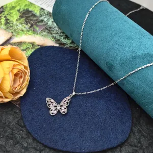 Exquisite hollow butterfly clavicle chain necklace featuring sparkling pink and white cubic zirconia.
