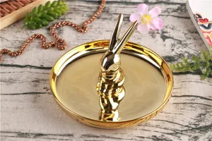 Gold ceramic rabbit ring holder detail view, luxury jewelry storage tray for home desk decor.