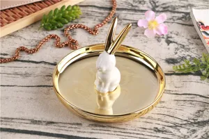 Ceramic rabbit jewelry tray detail, gold plated rim, cute bunny ring holder for desk decor.