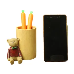 Cute cartoon bear pen holder resin desk organizer with carrot pens, creative office decor.