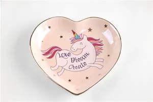 Leuke keramische harten schaal met een eenhoorn print, gouden rand en roze design.
