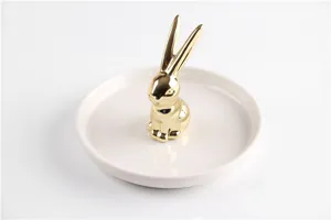 Luxury golden ceramic rabbit ring holder tray for jewelry storage, elegant desktop display stand.