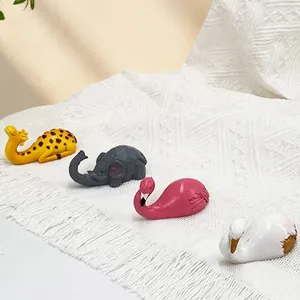 Cute animal sticky hooks set featuring giraffe, elephant, flamingo, and swan for wall decor.